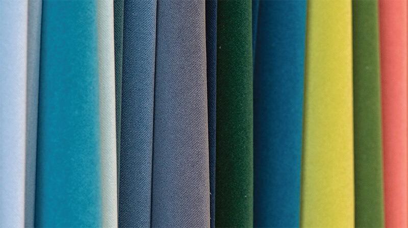 a rainbow of velvet fabric samples in different colors 